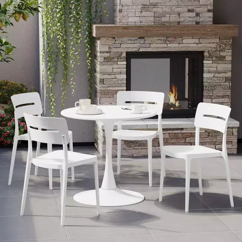 WestinTrends Playa 5-Piece Outdoor Indoor Round Metal Patio Dining Table Set With Stackable Patio Chairs