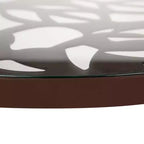 LeisureMod Devon Ensemble de salle à manger d'extérieur 5 pièces - Table ronde en verre avec 4 chaises empilables noires à motif floral